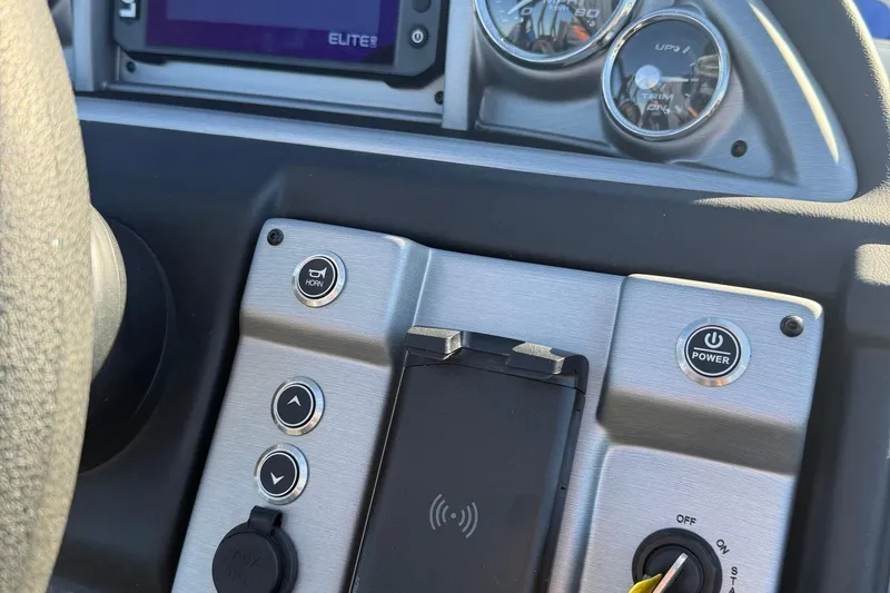 Slide: The Image of 2024 Berkshire 25RFX STS dashboard with controls and gauges, featuring power and horn buttons. - 15