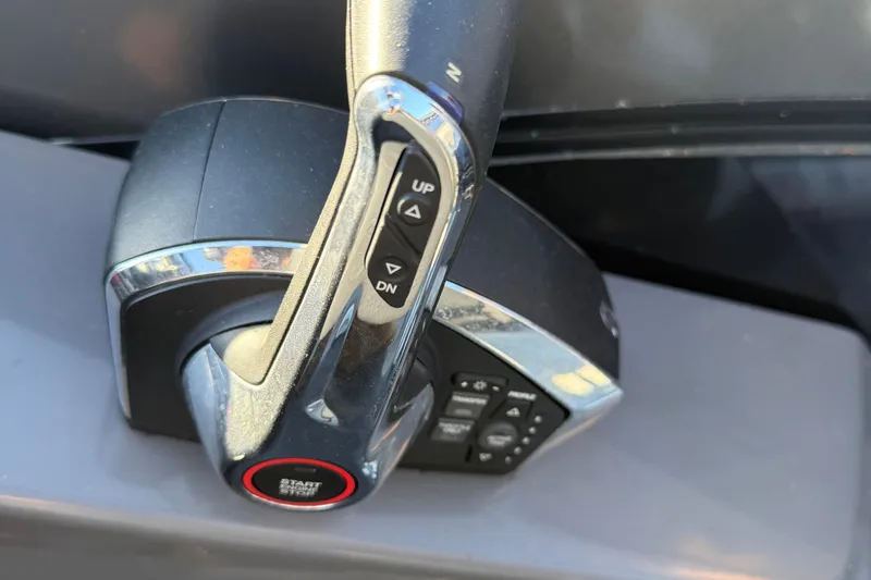 Slide: The Image of 2024 Berkshire 25RFX STS throttle control with start button and directional controls. - 17
