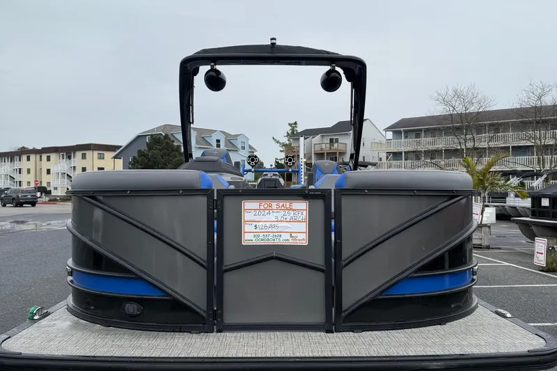 Slide: The Image of 2024 Berkshire 25RFX STS pontoon boat for sale in a parking lot. - 2