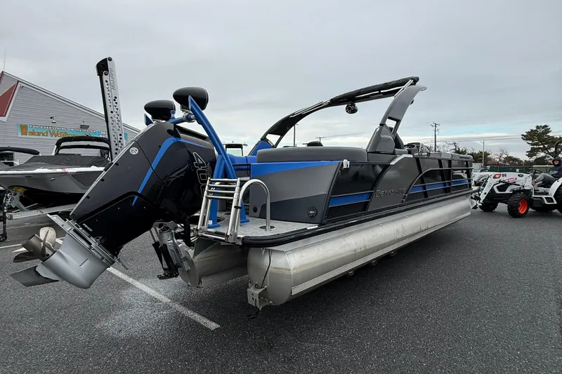 Slide: The Image of 2024 Berkshire 25RFX STS pontoon boat with sleek design and powerful outboard motor. - 8