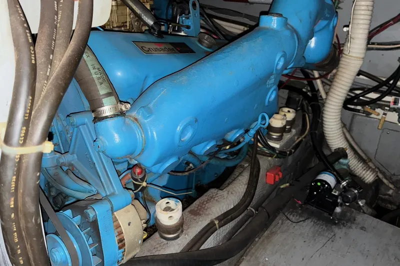 Slide: The Image of Engine compartment of 1988 Chris-Craft 381 Catalina with blue components and wiring. - 22