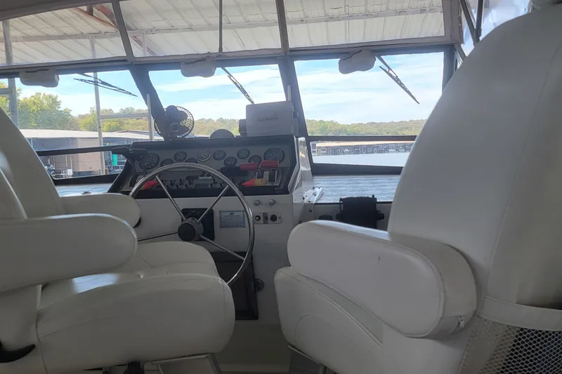 Slide: The Image of 1988 Chris-Craft 381 Catalina helm with white seats and dashboard view. - 5