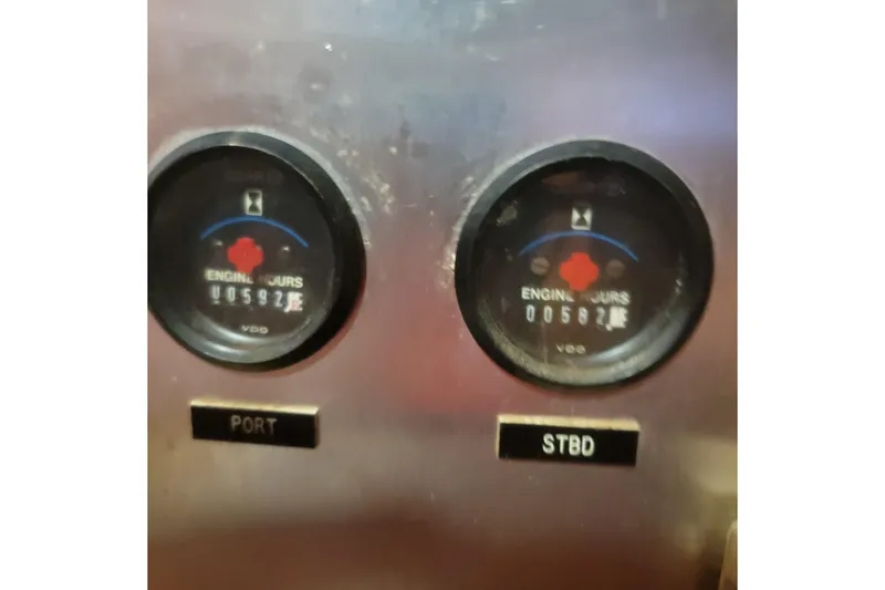 Slide: The Image of 1988 Chris-Craft 381 Catalina engine hour meters, showing port and starboard readings. - 7