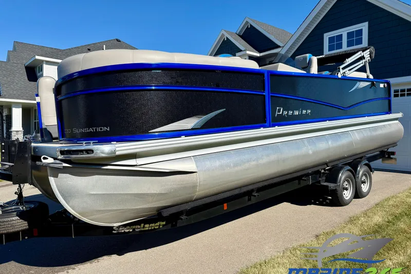The Image of 2016 Premier 230 SunSation Echo RF pontoon boat on trailer, parked in residential driveway. - 0