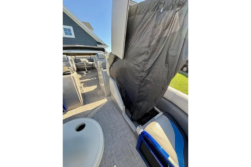 Slide: The Image of 2016 Premier 230 SunSation Echo RF pontoon boat interior with seating and cover. - 16