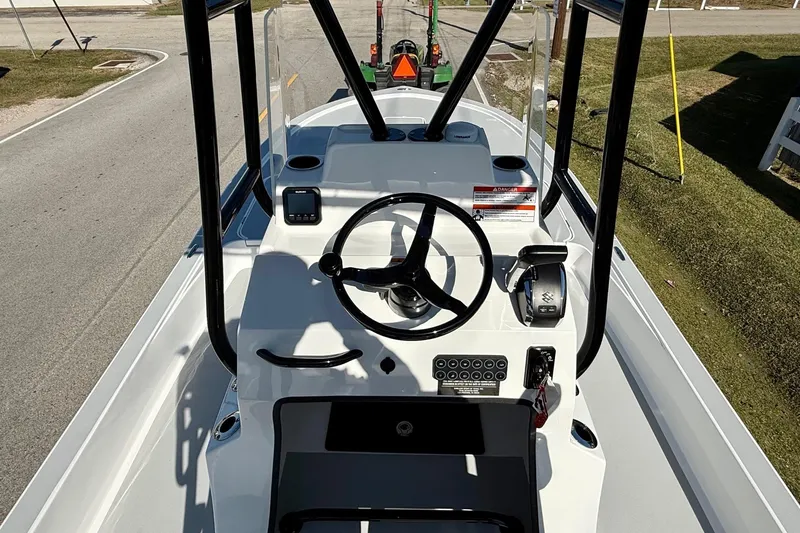 Slide: The Image of 2026 Shallow Sport 25 X3 boat with cushioned seating and powerful engine. - 10