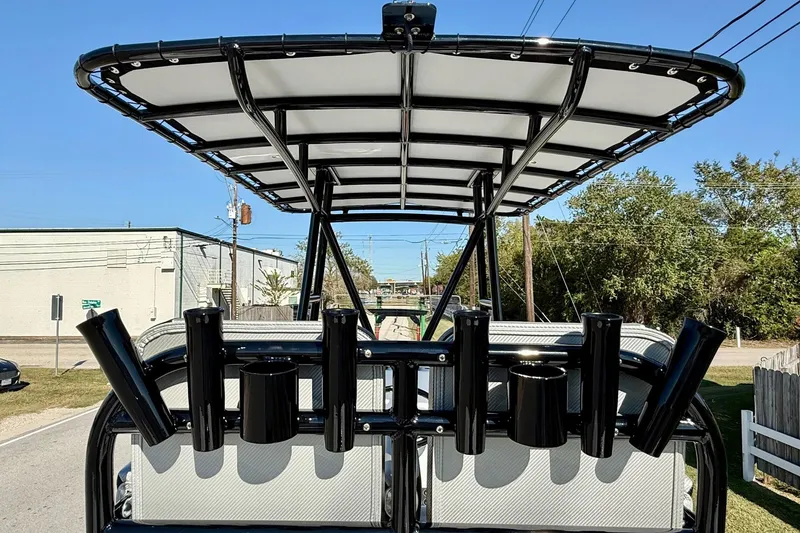 Slide: The Image of 2026 Shallow Sport 25 X3 boat console with steering wheel and controls. - 11