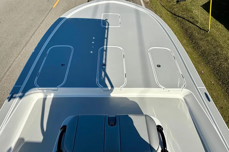 Slide: The Image of 2026 Shallow Sport 25 X3 boat on road, showcasing sleek design and features. - 13