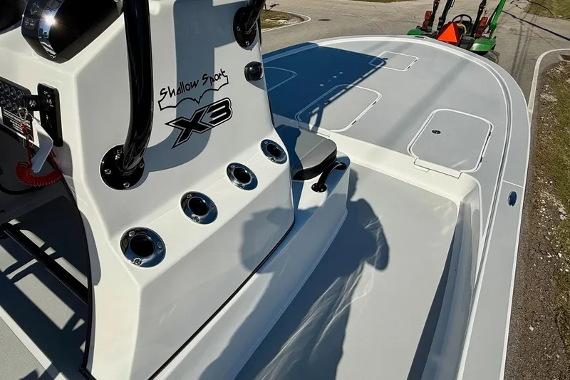 Slide: The Image of 2026 Shallow Sport 25 X3 boat deck with storage compartments and seating. - 14