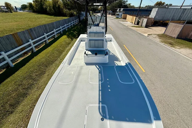 Slide: The Image of 2026 Shallow Sport 25 X3 boat interior with control panel and seating area. - 15