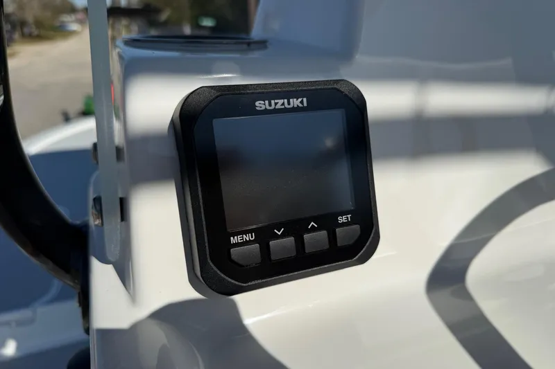 Slide: The Image of 2026 Shallow Sport 25 X3 boat on a road, showcasing spacious deck and seating. - 16