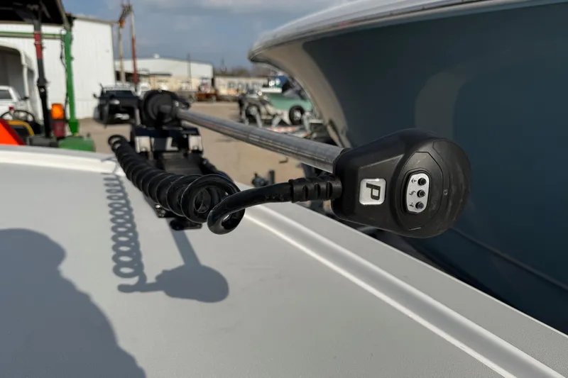 Slide: The Image of Close-up of a 2026 Shallow Sport 25 X3 boat's trolling motor in a marina setting. - 18