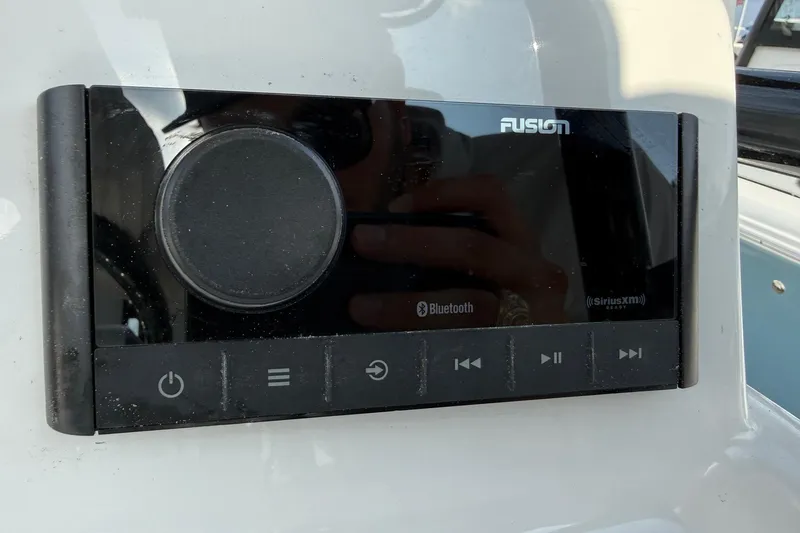 Slide: The Image of Fusion audio system on 2026 Shallow Sport 25 X3 boat, featuring Bluetooth and SiriusXM capabilities. - 19