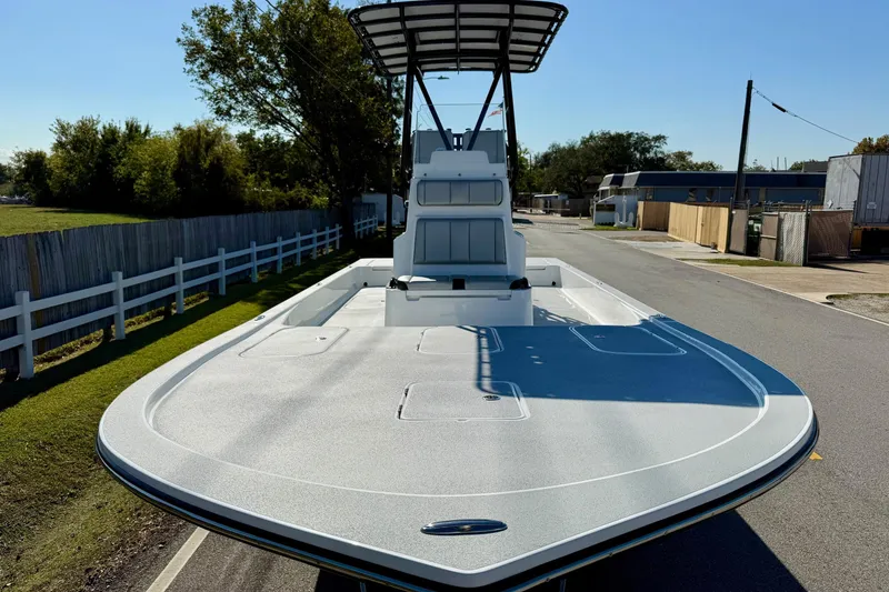 Slide: The Image of 2026 Shallow Sport 25 X3 boat on trailer, featuring dual engines and elevated seating. - 6
