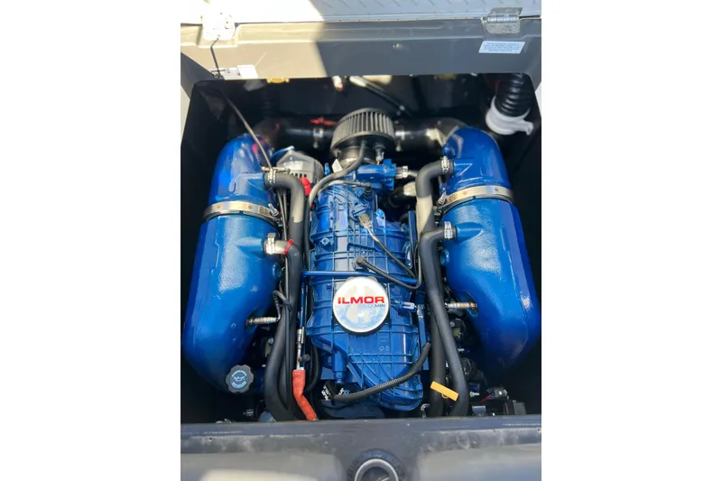 Slide: The Image of 2020 MasterCraft XT23 Ilmor engine, blue components, top view. - 12