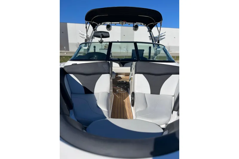 Slide: The Image of 2020 MasterCraft XT23 boat interior with sleek seating and modern design. - 14