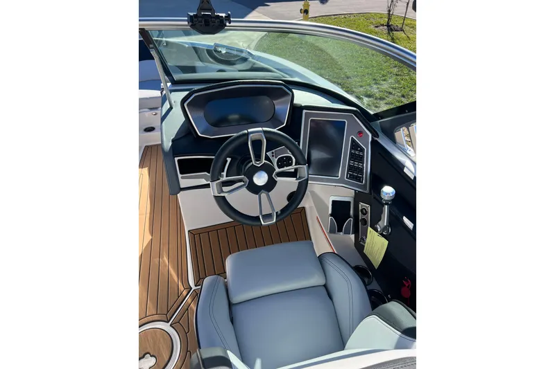 Slide: The Image of 2020 MasterCraft XT23 boat cockpit with modern steering and control panel. - 7