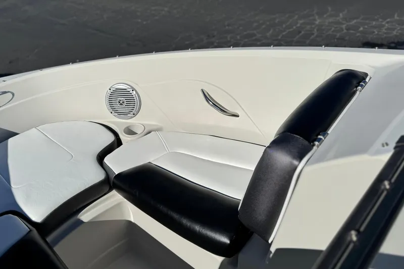 Slide: The Image of Interior seating of a 2016 Tahoe 500 TS boat, featuring black and white upholstery. - 13