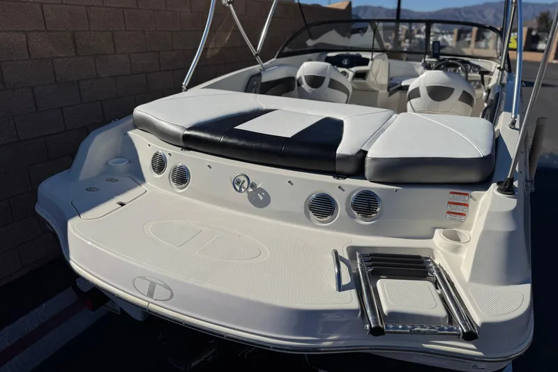 Slide: The Image of 2016 Tahoe 500 TS boat with white seating and swim platform. - 7