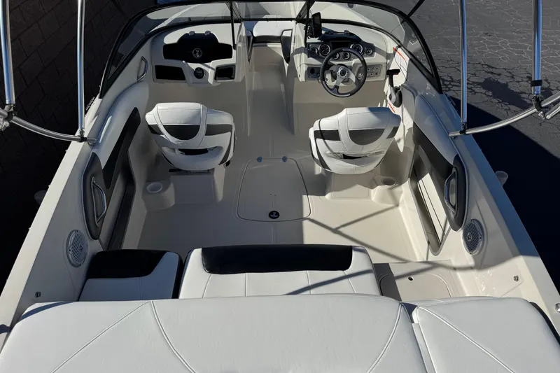 Slide: The Image of 2016 Tahoe 500 TS boat interior with white seating and steering console. - 9