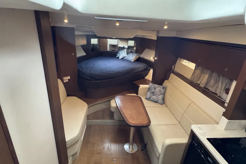 Slide: The Image of Interior of 2018 Sea Ray Sundancer 350 Coupe with cozy seating and sleeping area. - 14