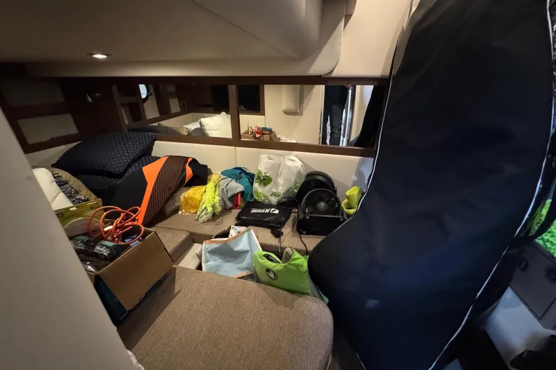 Slide: The Image of Interior of 2018 Sea Ray Sundancer 350 Coupe with various items and equipment. - 22