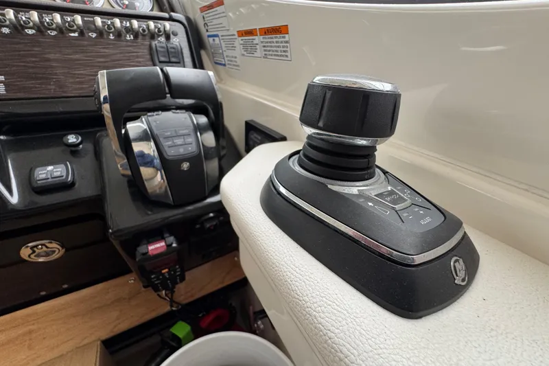 Slide: The Image of Control panel of 2018 Sea Ray Sundancer 350 Coupe with joystick and throttle. - 28