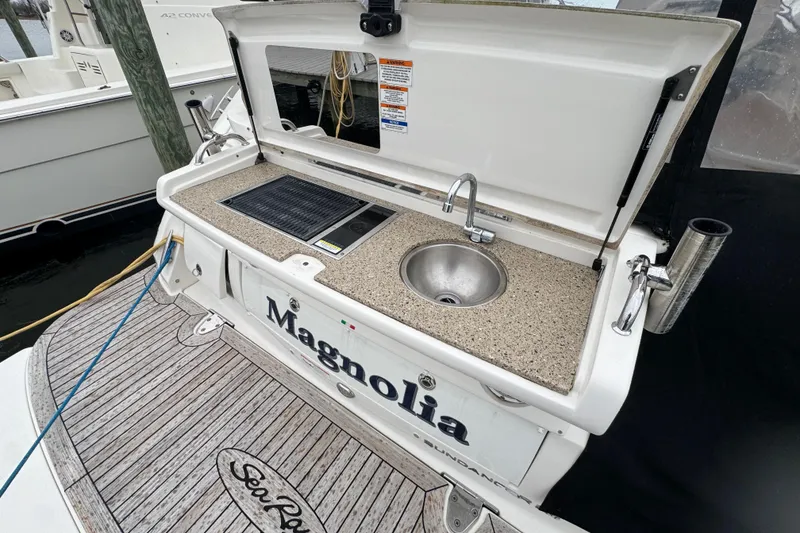 Slide: The Image of 2018 Sea Ray Sundancer 350 Coupe with outdoor sink and grill on deck. - 3