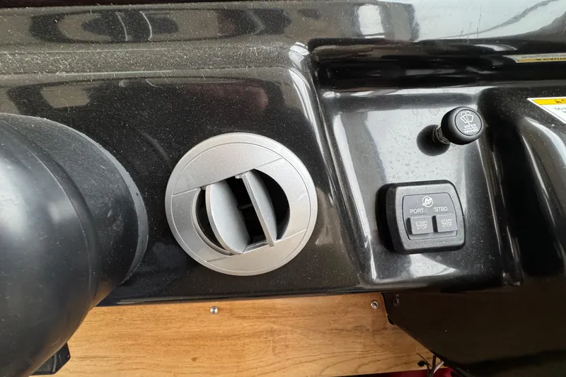 Slide: The Image of 2018 Sea Ray Sundancer 350 Coupe dashboard controls with vent and buttons. - 35