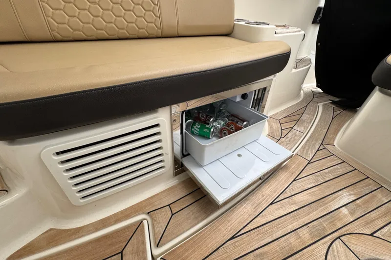 Slide: The Image of 2018 Sea Ray Sundancer 350 Coupe interior with built-in cooler drawer and stylish seating. - 38