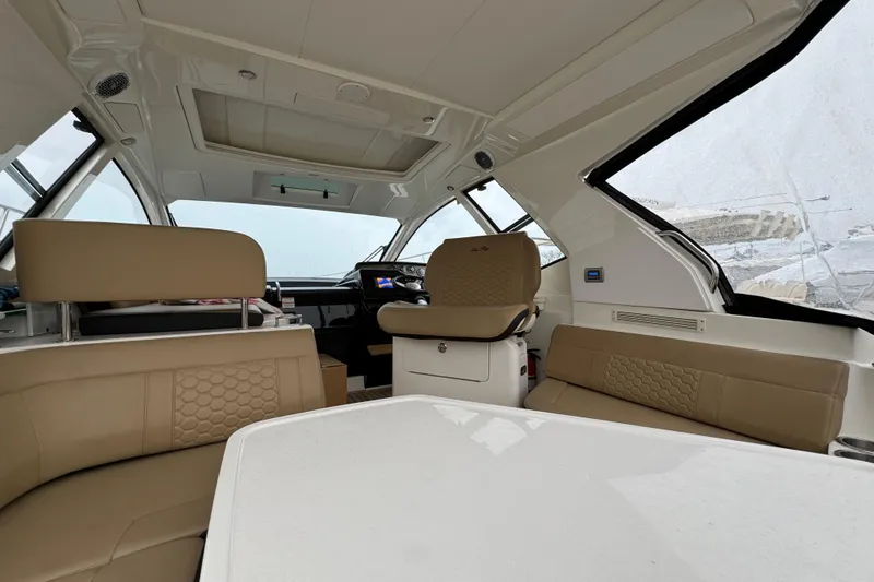 Slide: The Image of Interior of 2018 Sea Ray Sundancer 350 Coupe with beige seating and modern design. - 54