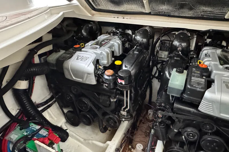 Slide: The Image of Engine compartment of a 2018 Sea Ray Sundancer 350 Coupe with dual V8 engines. - 58