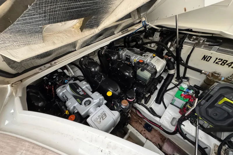 Slide: The Image of Engine compartment of a 2018 Sea Ray Sundancer 350 Coupe, showcasing detailed mechanical components. - 63