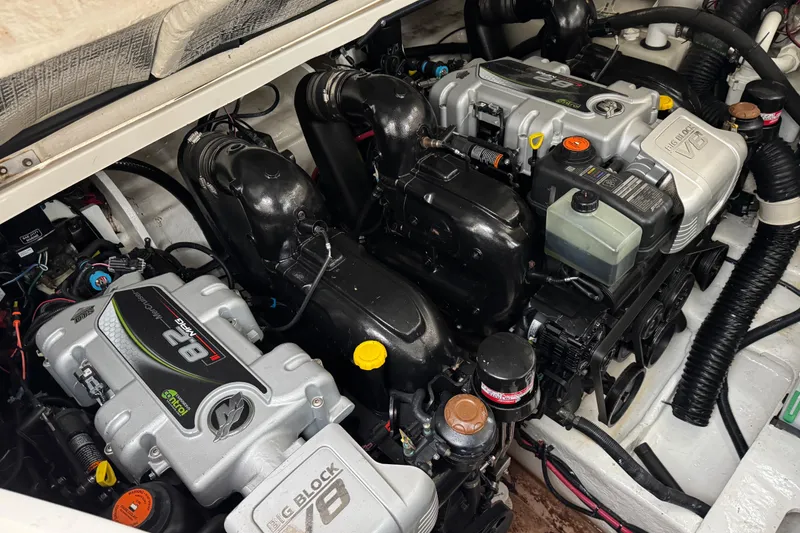 Slide: The Image of Engine compartment of a 2018 Sea Ray Sundancer 350 Coupe with dual V8 engines. - 64