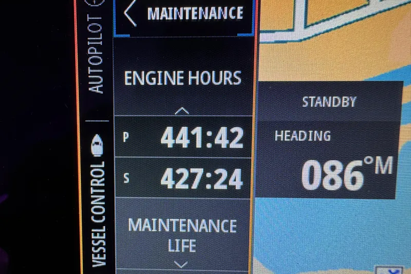 Slide: The Image of Display panel of 2018 Sea Ray Sundancer 350 Coupe showing engine hours and heading. - 69