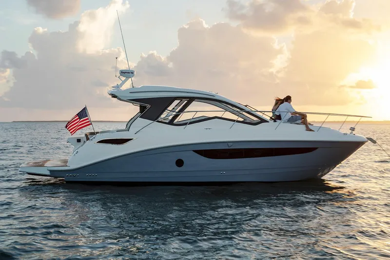 Slide: The Image of Manufacturer Provided Image: 2018 Sea Ray Sundancer 350 Coupe yacht at sunset on the water. - 76