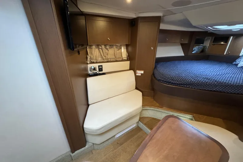 Slide: The Image of Interior of 2018 Sea Ray Sundancer 350 Coupe with seating and bed area. - 8