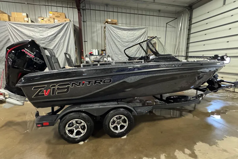 Slide: The Image of 2026 Nitro ZV19 Sport boat in a garage, featuring sleek design and powerful engine. - 0