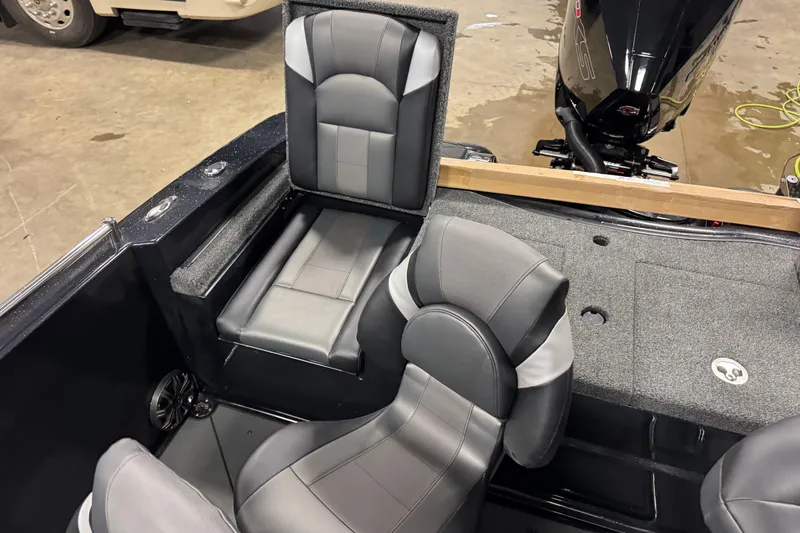 Slide: The Image of 2026 Nitro ZV19 Sport boat interior with gray seating and motor view. - 13