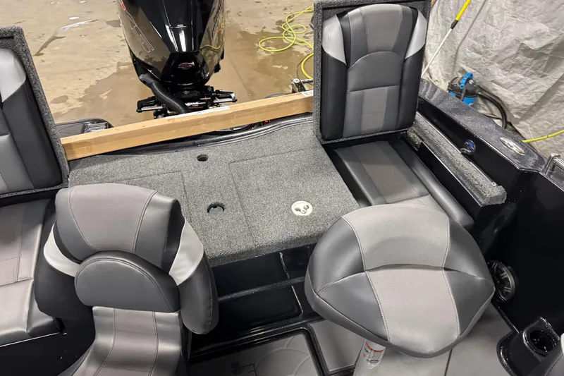 Slide: The Image of 2026 Nitro ZV19 Sport boat interior with gray seating and motor view. - 14