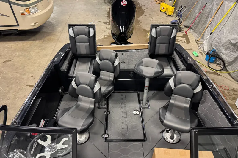 Slide: The Image of Interior of 2026 Nitro ZV19 Sport boat with modern seating and steering wheel. - 19