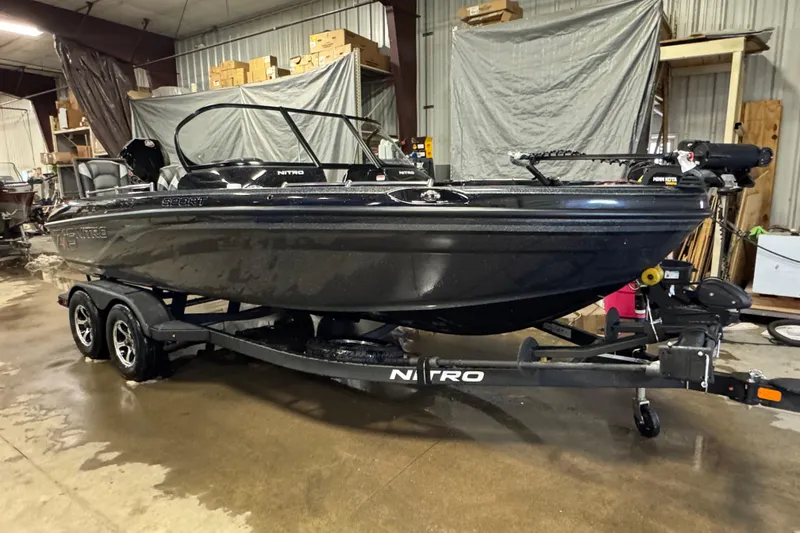 Slide: The Image of 2026 Nitro ZV19 Sport boat in a garage, on a trailer. - 2