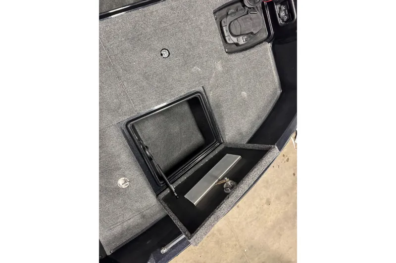 Slide: The Image of Open storage compartment in 2026 Nitro ZV19 Sport boat interior. - 25