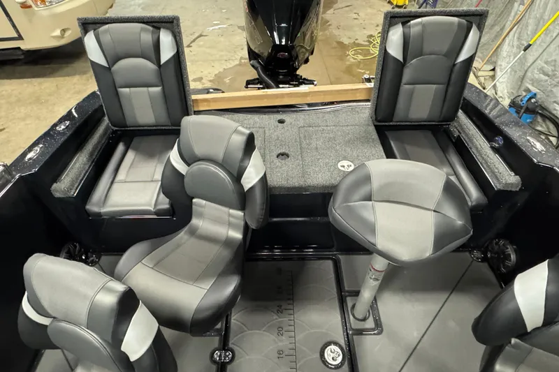 Slide: The Image of 2026 Nitro ZV19 Sport boat interior with sleek black and gray seating arrangement. - 5