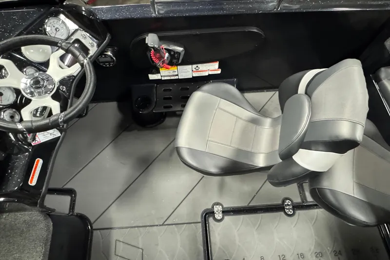 Slide: The Image of Interior of 2026 Nitro ZV19 Sport boat with steering wheel and seating. - 6