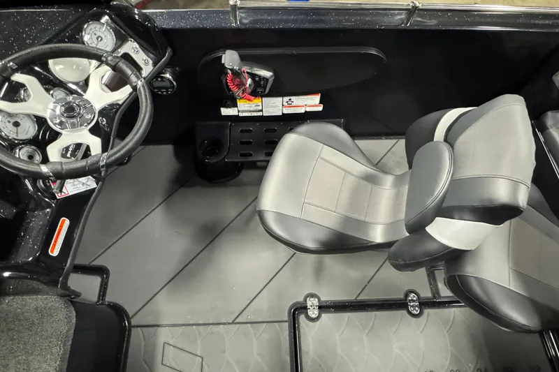 Slide: The Image of Interior of 2026 Nitro ZV19 Sport boat with steering wheel and seating. - 7