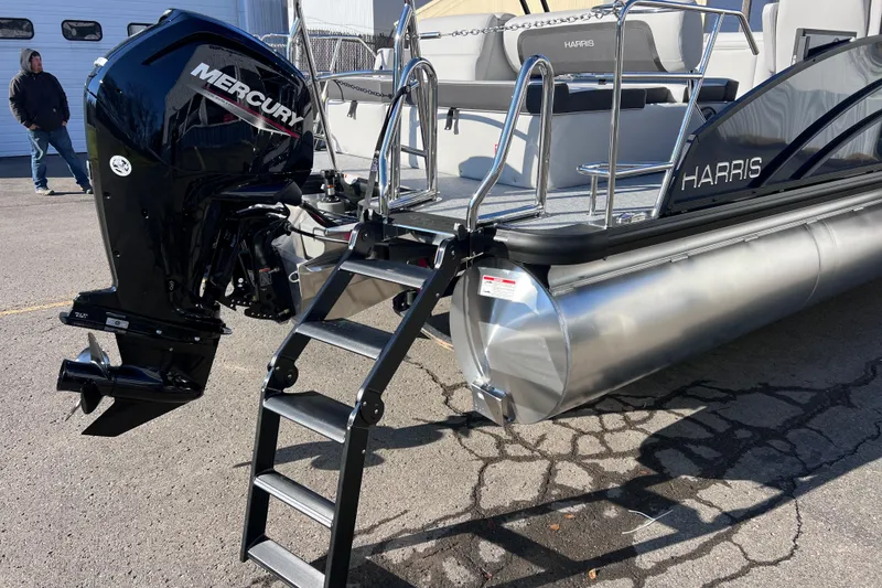 Slide: The Image of 2026 Harris 210 Cruiser SLDH pontoon boat with Mercury outboard motor and boarding ladder. - 10