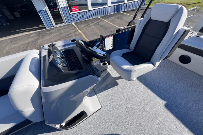 Slide: The Image of 2026 Harris 210 Cruiser SLDH boat interior with modern helm and comfortable seating. - 18