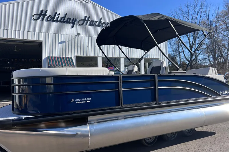 Slide: The Image of 2026 Harris 210 Cruiser SLDH pontoon boat at Holiday Harbor dealership. - 2