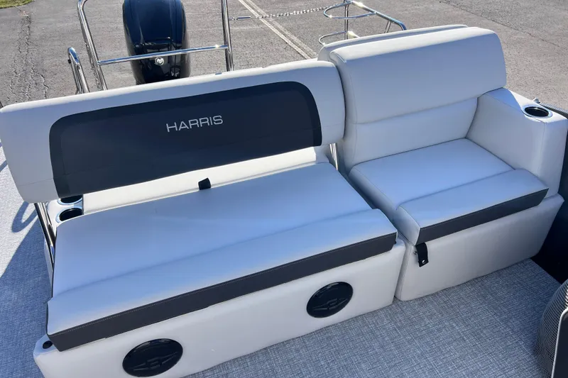 Slide: The Image of 2026 Harris 210 Cruiser SLDH boat seating with cup holders and sleek design. - 21